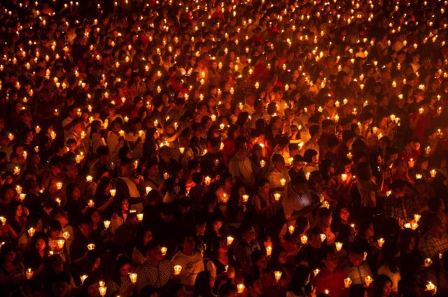 Indonesian Christians attending mass on Christmas Eve at a stadium in Surabaya, the country"s second largest city