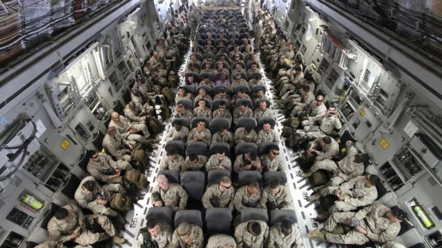 US troops on board a transporter plane in Afghanistan