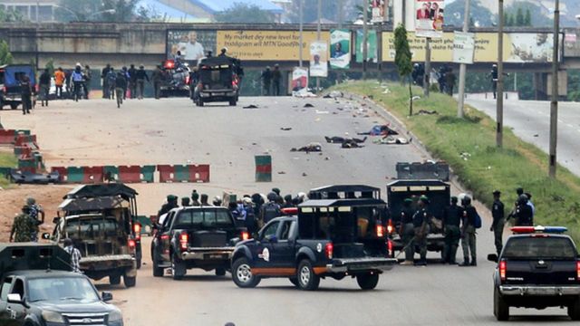 Members of Islamic Movement of Nigeria (IMN) wave flags and chant slogans as they take part in a demonstration to protest against an imprisoned Shiite cleric, in Abuja