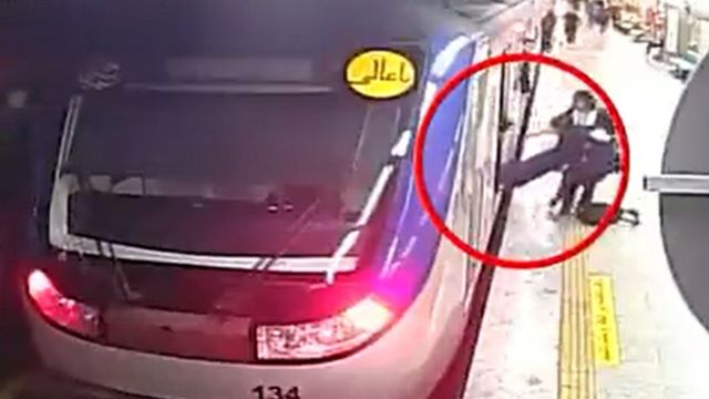 CCTV footage posted by Iran's state news agency, Irna, showing Armita Geravand being pulled unconscious from a metro train at Tehran's Shohada station on 1 October 2023