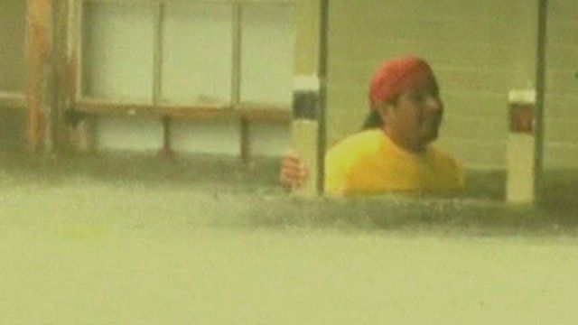 Man in flood water outside Louisiana home