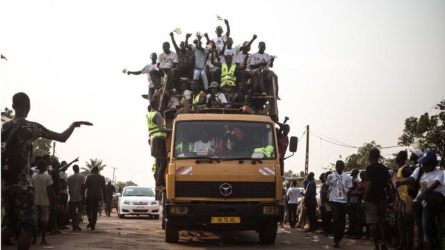 Supporters of the incumbent Central African republic president President Faustin-Archange Touadera, arrive at the headquarters of his party, the Movement United Hearts (MCU) after the announcement of the validation of the results of the presidential election of December 27, 2020 by the Constitutional Court in Bangui, on January 18, 2021.