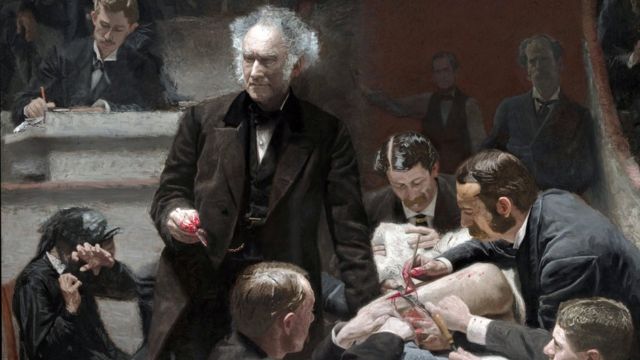 The Clinic of Dr. Gross, is an 1875 painting by American artist Thomas Eakins. Dr. Gross, dressed in a black frock coat, lectures a group of Jefferson Medical College students. Included among the group is a self-portrait of Eakins, who is seated to the right of the tunnel railing, sketching or writing