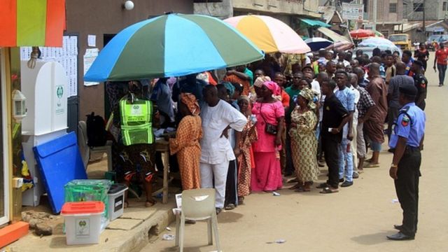 Voters line up to cast their ballots in an election in Nigeria