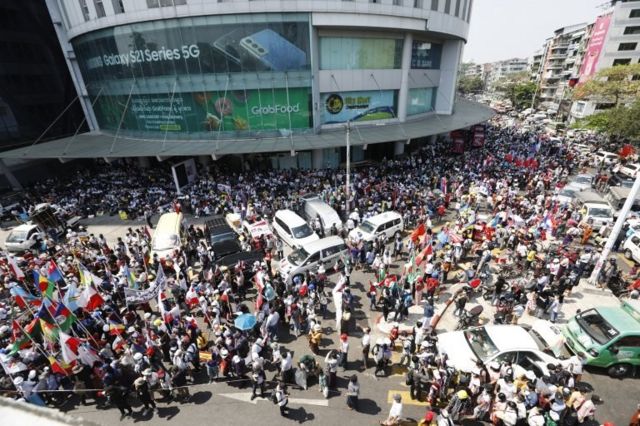 Demonstrators gather during a protest against the military coup, at Hledan Junction in Yangon, Myanmar, 24 February 2021