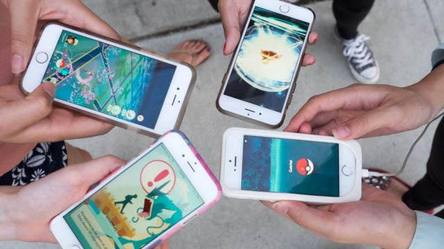 Pokemon Go players are seen in search of Pokemon and other in game items in Pasadena Playhouse District during PokeNight on July 27, 2016 in Pasadena, California.