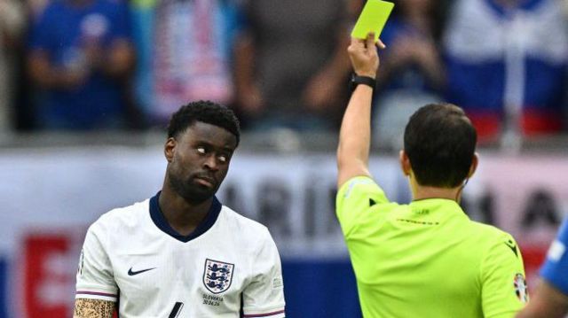 Marc Gueho receives yellow card for England