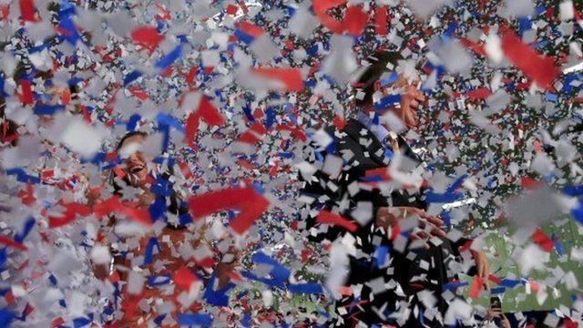 Republican U.S. presidential candidate John Kasich (R) and his wife Karen (L) celebrate amidst a storm of confetti