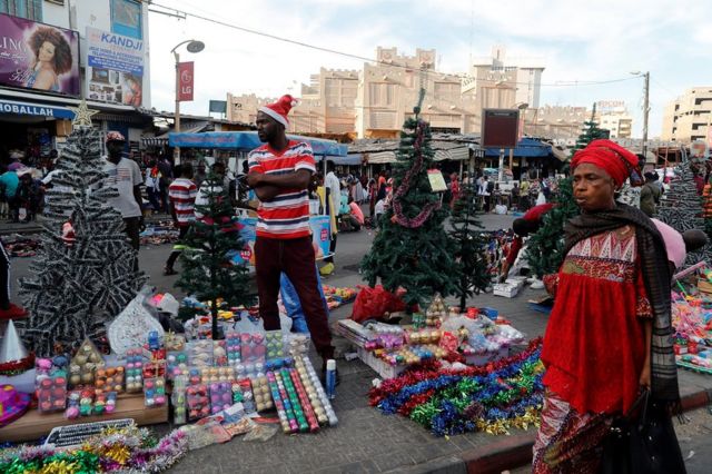 A street vendor sells Christmas decorations on a street in Dakar, Senegal