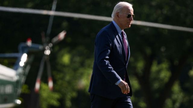 President Joe Biden walks on the Ellipse after stepping off Marine One near the White House
