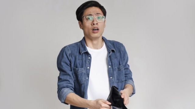 Man with empty wallet