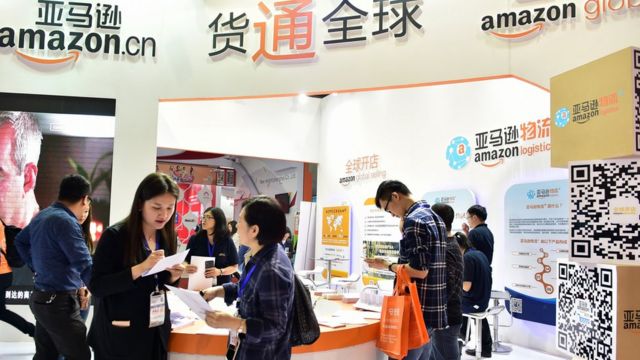 Visitors at an Amazon booth during the 2016 China International Electronic Commerce Expo in Yiwu, east China's Zhejiang province.
