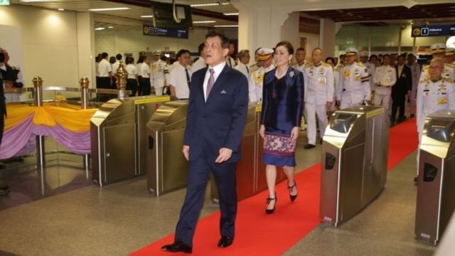 The King and Queen went through the train ticket verification machine.