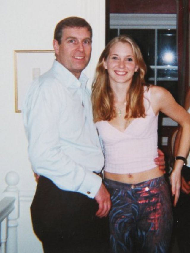 Prince Andrew, the Duke of York, with his arm around Virginia Roberts