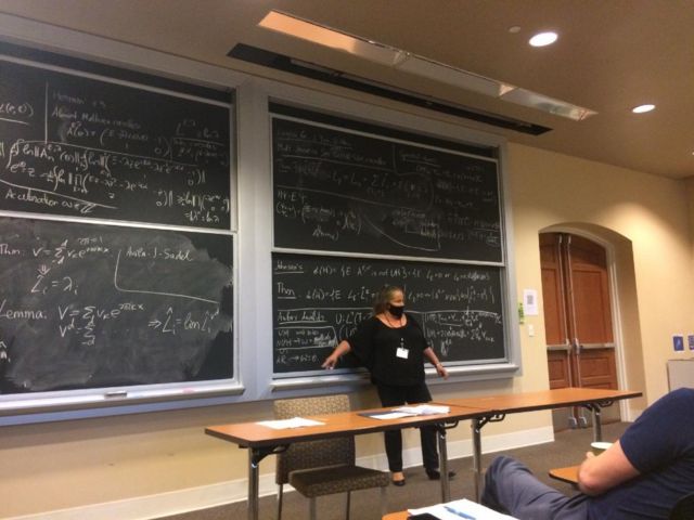 Svetlana Zhitomirskaya in front of the blackboard in the classroom