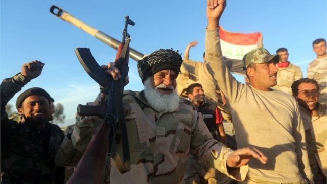 Iraqi Shia fighters, members of Iraq's Popular Mobilisation Units celebrating