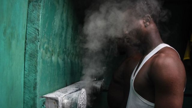 Man inhaling steam in Tanzania