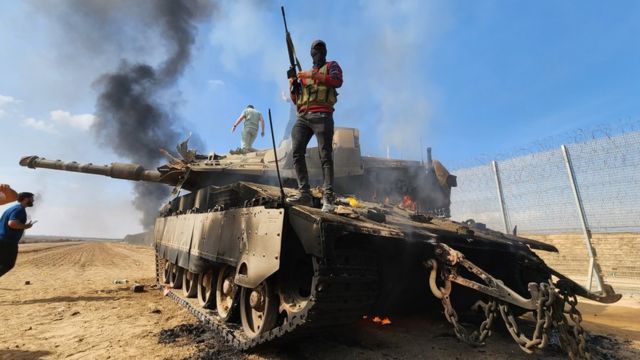 Hamas's military wing, the Izzedine al-Qassam Brigades, destroy an Israeli tank in Gaza City, Gaza on 7 October 2023