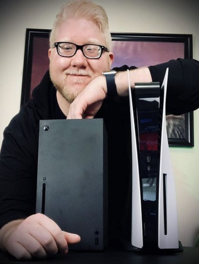 Steve Saylor posing with one of his consoles