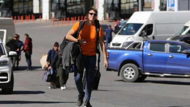 Strangers with suitcases