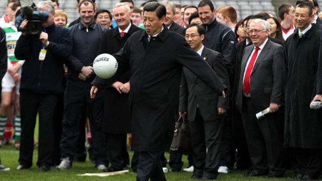 Chinese President Xi Jinping kicks a soccer ball during his visit to Croke Park in Dublin on February 19, 2012.