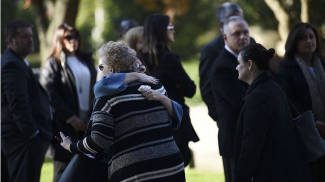 Women embrace as they arrive outside the Rodef Shalom Congregation where the funeral for shooting victims Cecil Rosenthal and David Rosenthal will be held