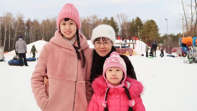 Huong and daughters at ski resort 