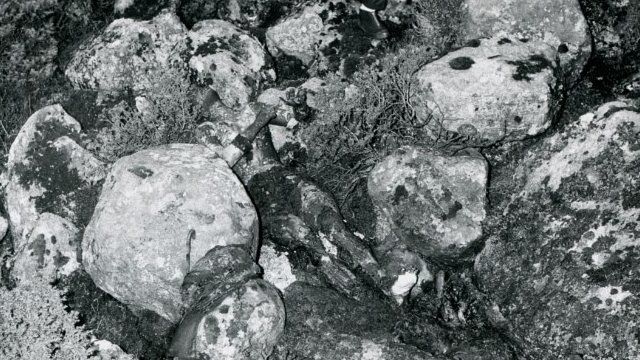 An archive photo showing the Isdal Woman's body lying across the rocks