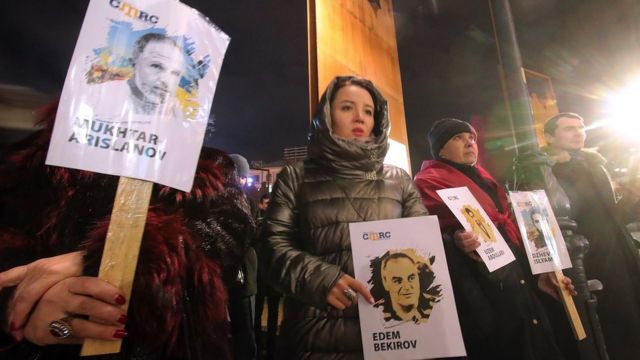 Protesters hold placards at a rally called 'Remember: Crimea is Occupied' in Maidan Nezalezhnosti, Kyiv on 27 February 2019