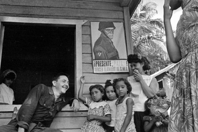 Rauel Castro talking with a family of countrymen. Cuba, 1964. (Photo by Gilberto Ante/Roger Viollet via Getty Images)