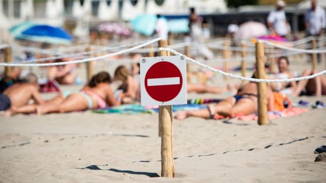 A sign on a beach in France