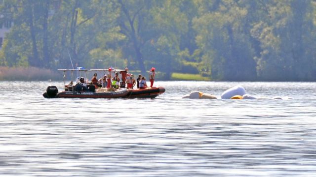 Carabinieri and fire brigade officers take part in the search and rescue operation in Lake Maggiore after a tourist boat capsized near Lisanza (Varese), northern Italy, 29 May 2023