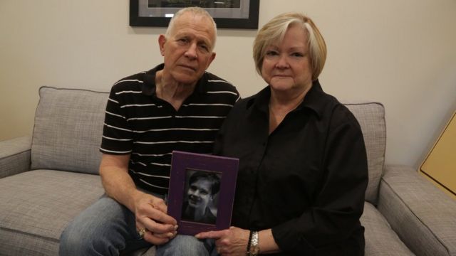 Judy and Dennis Shepard hold a photo of their son at the Denver office of the Matthew Shepard Foundation on 17 October 2018