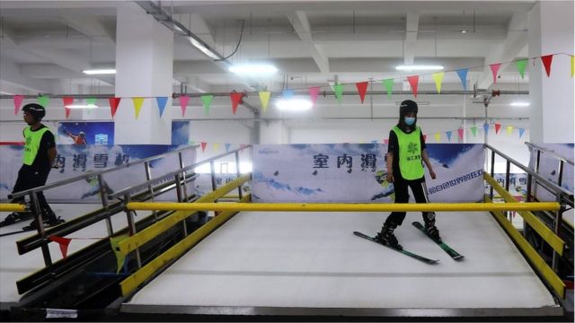 Employees demonstrate indoor ski machines at Zhangjiakou Ice and Snow Sports Equipment Industrial Park, during an organised media tour to venues of the Beijing 2022 Winter Olympic Games in Zhangjiakou, Hebei province, China July 15, 2021.