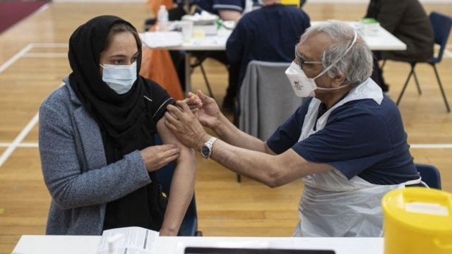 A woman being vaccinated at Karimia Institute Islamic centre and Mosque in Nottingham