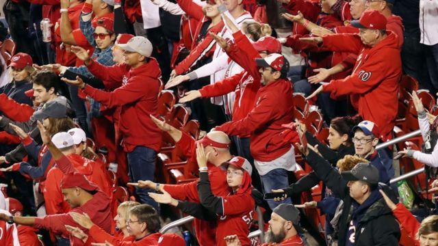 Fans in a US stadium do the Baby Shark dance.