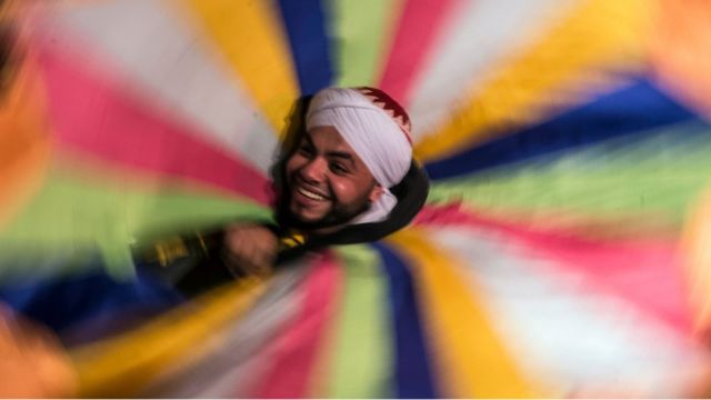 An Egyptian dancer performs the Tanoura during the holy fasting month of Ramadan, at el-Ghuri culture Palace in Cairo on May 22, 2018.