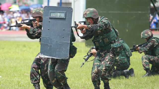 Soldiers of the People's Liberation Army (PLA) perform drills at the PLA Ngong Shuen Chau Barracks in Hong Kong