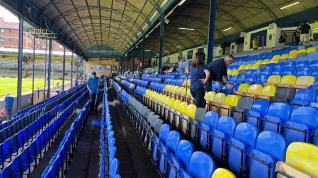 Southend United fans clearing up Roots Hall Stadium