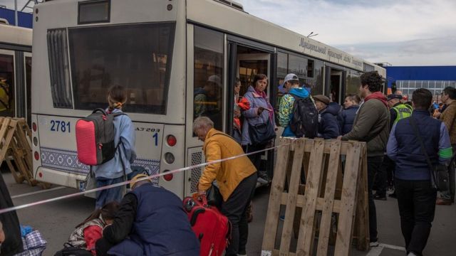 People evacuated from the steel plant Azovstal, Mariupol city and the surrounding areas gather after arriving on buses in Zaporizhzhia, Ukraine, 3 May 2022