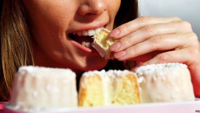 Woman eating cake