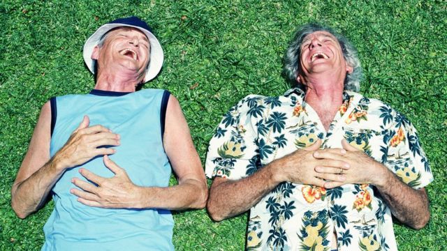 Two older men laughing