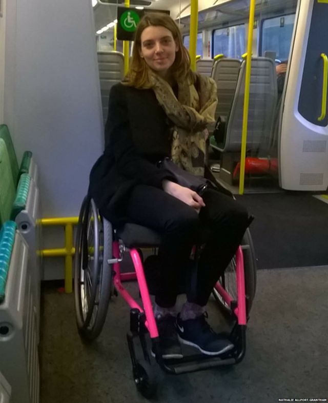 Nathalie in a wheelchair