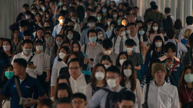 A crowd wearing surgical masks in China