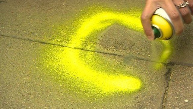 Spraying pavement to highlight chewing gum