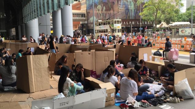 Hong Kong's financial centre becomes a meeting place for foreign domestic helpers on weekends.