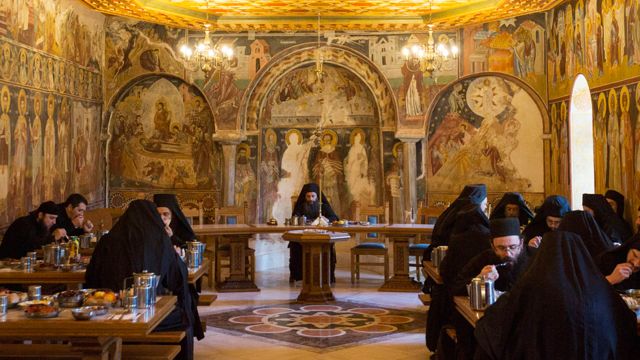 Monks eat in silence in the refectory of Pantokratoros monastery on December 3, 2016 in Mount Athos,Greece. Some of the buildings on the mountain date back to the 10th century, many of which are still in use to this day