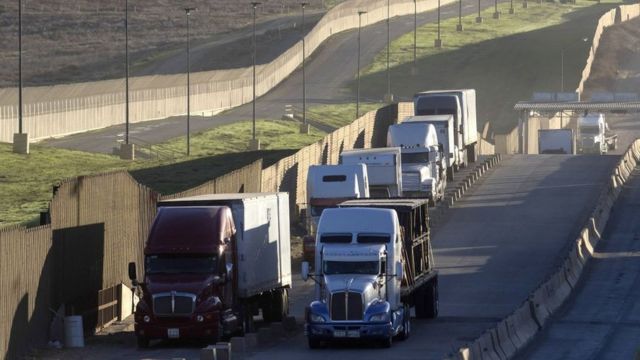 Trucks drive along the border