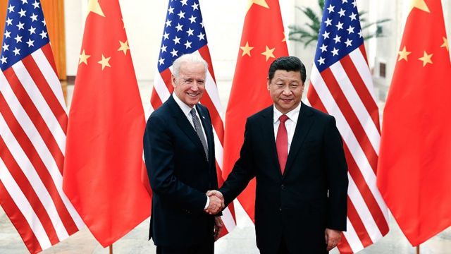 Chinese President Xi Jinping (R) shake hands with U.S Vice President Joe Biden (L) inside the Great Hall of the People on December 4, 2013 in Beijing, China
