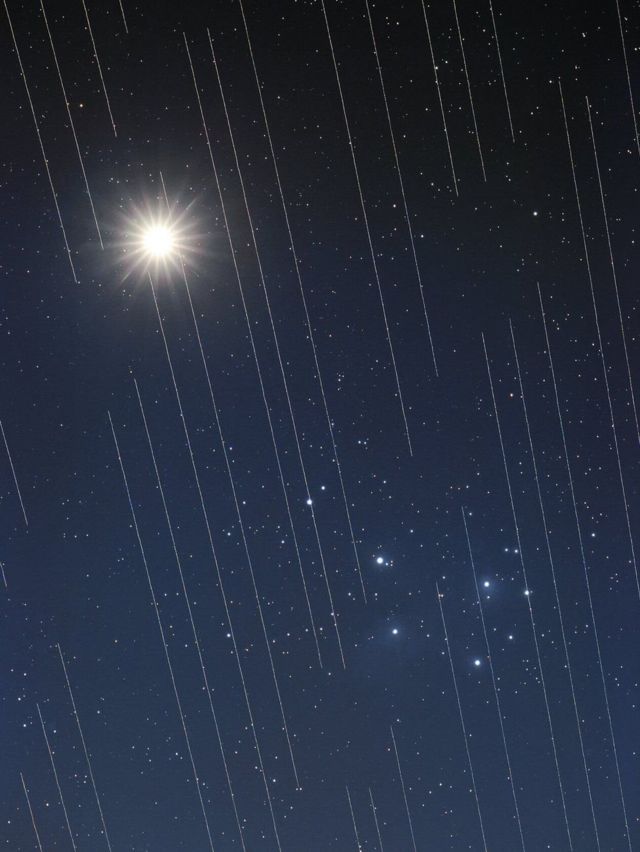 Starlink satellites cross over Venus and the Pleiades ("Seven Sisters") group of stars